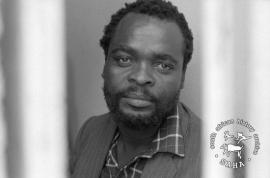 This black and white photograph of Pupsey Sebogodi in the Lekubung police cell in Motswedi was taken by Gille de Vlieg on 27 March 1989. This photograph was digitised by Africa Media Online (AMO) in 2009. Included in SAHA Land Act Project report, 2014.