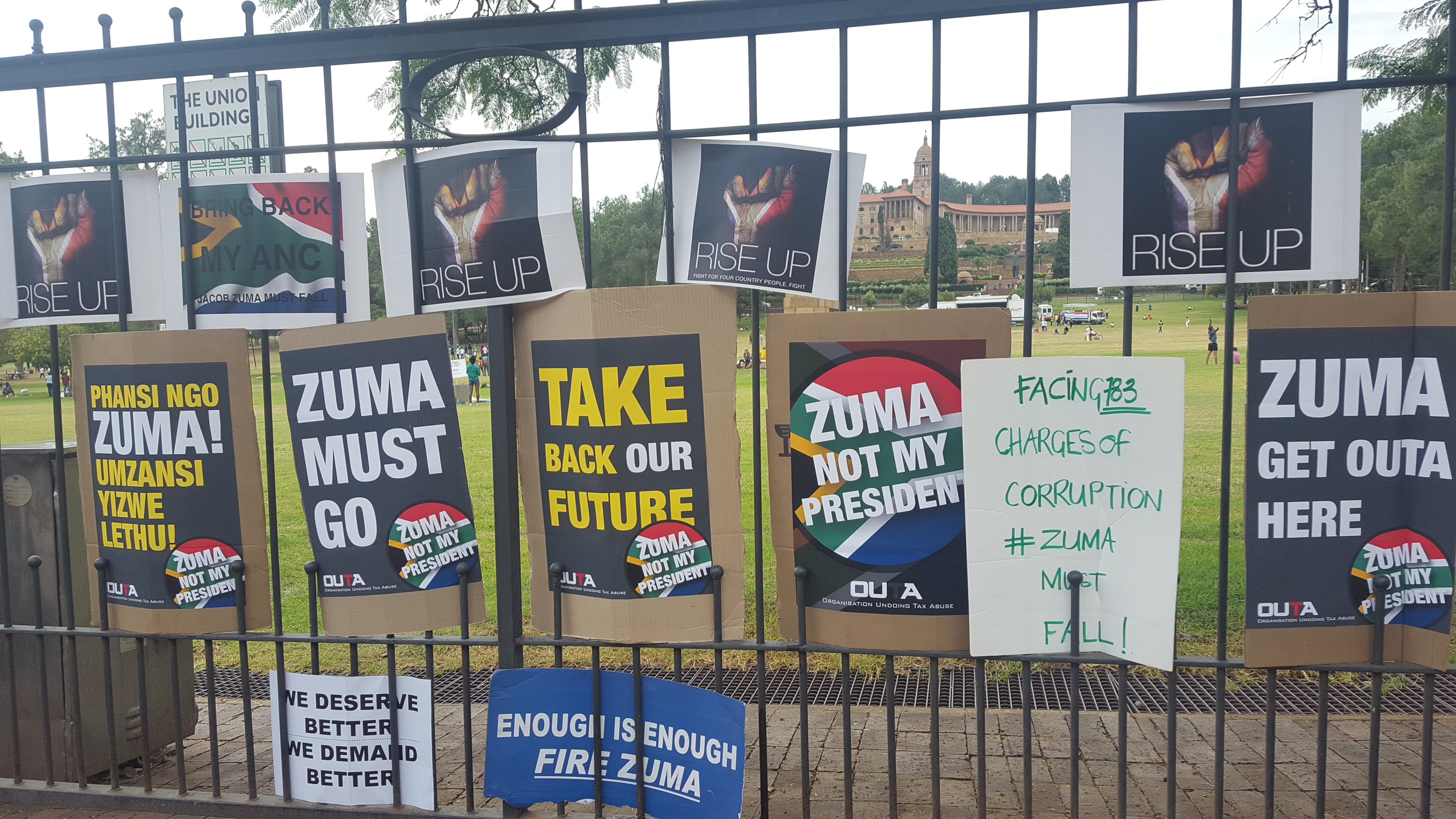 Fence with posters attached outside of union buildings