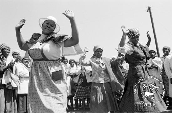 AL3274_D26.06 	Women dancing after signing a petition against incorporation into Bophuthatswana, Braklaagte