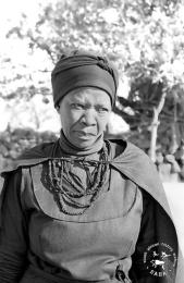 This black and white photograph of Driefontein resident Nomhlangano Beauty Mkhize, Saul Mkhize's widow, was taken by Gille de Vlieg in June 1983. Included in SAHA Land Act Project report, 2014.