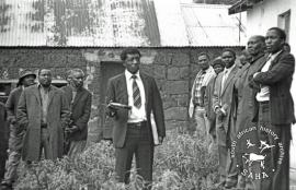 This black and white photograph of Saul Mkhize at a meeting was taken by Gille de Vlieg in March 1983. The following month, on 2 April 1983 he was killed by a policeman at a meeting held at Qalani primary school. Included in SAHA Land Act Project report, 2014.