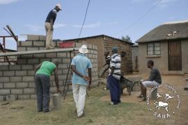 This digital colour of youth building a house in Driefontein was taken by Gille de Vlieg for the SAHA Land Act 1913 Legacy Project in June 2013