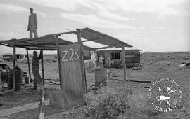 This black and white photograph of men building a new home structure in Barseba was taken by Gille de Vlieg in March 1984. Included in SAHA Land Act Project report, 2014.