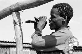 This black & white photograph of a man building his new home was taken by Gille de Vlieg in March 1984. This photograph was digitised by Africa Media Online (AMO) in 2009. Included in SAHA Land Act Project report, 2014.