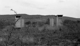 This is a black and white photograph of JToilets & thorns, Onderstepoort in Mogopa was taken by Gille de Vlieg on 06 June 1993. Included in SAHA Land Act Project report, 2014.