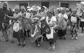 This is a black and white image of women dancing at Driefontein during an opening of a clinic in the area. Image taken by Gille de Vlieg. This image is also included in the LA virtual exhibition