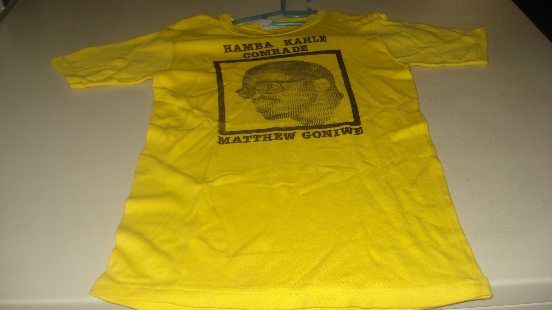 Hamba Kahle Comrade: Matthew Goniwe, T-shirt, SAHA Ephemera Collection, AL2540_A286 Hamba Kahle Comrade: Matthew Goniwe, T-shirt, SAHA Ephemera Collection, AL2540_A286