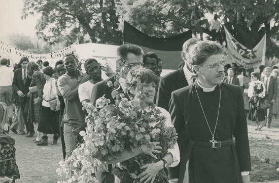 Maggie Friedman and Rev. Paul Verryn walking to the grave-side.