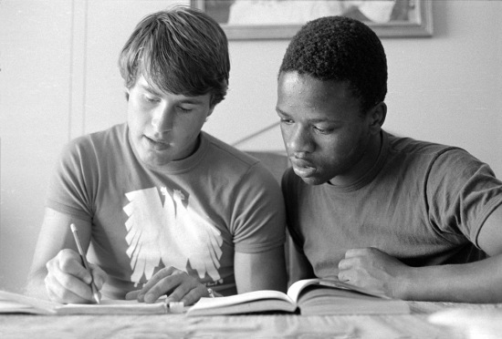 Youth helping with homework ('each one teach one'), Johannesburg, Gauteng, 1985-09-29. Photograph by Gille de Vlieg. Archived as SAHA collection AL3274_C.35
