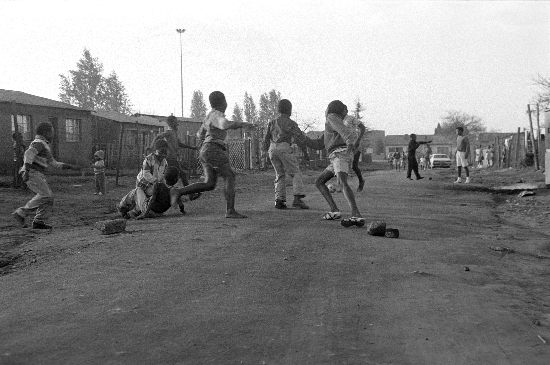 Children playing township soccer, AL3274_F27.2, Gille de Vlieg Collection Children playing township soccer, AL3274_F27.2, Gille de Vlieg Collection