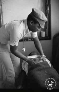 A pregnant woman being attended to by Dr Bango at Victory Camp's health centre