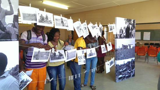 Learners engaging with the Land Act exhibition during a workshop in Mogopa, 2013