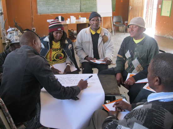 Participants at the workshop considering the information needs of their community.