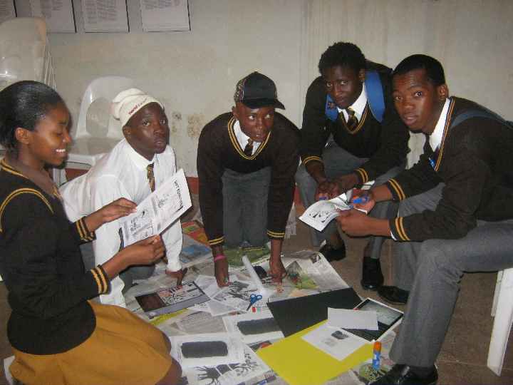 Matrics from Vuwani Secondary School creating a collage reflecting their own views on the TRC.