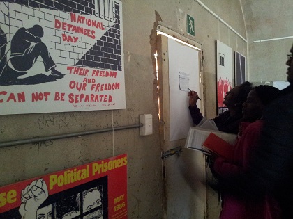 Educators interacting with exhibition as part of a workshop on using John Vorster Square as a case study for teaching apartheid history 
